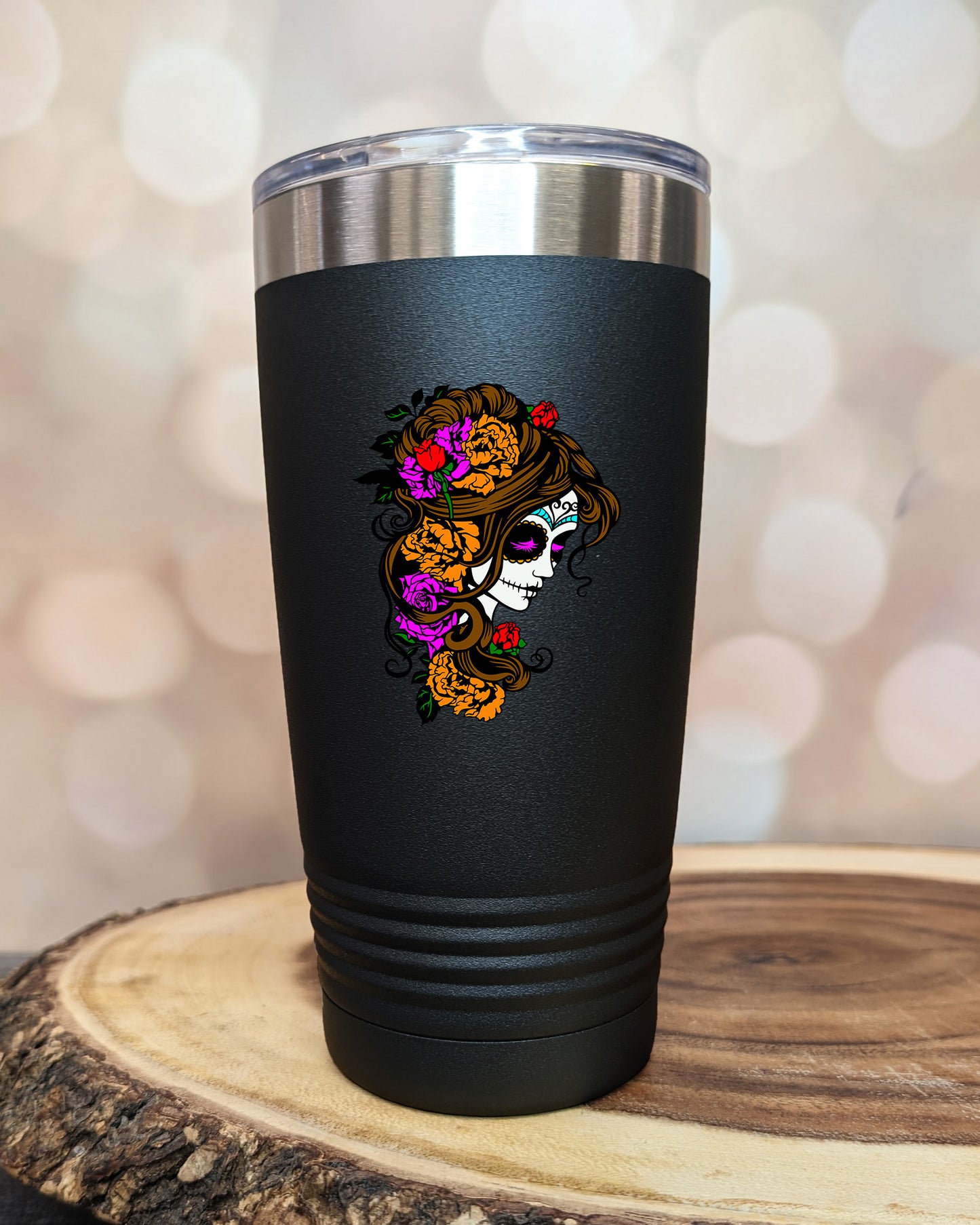 insulated tumbler featuring a colorful sugar skull woman portrait with floral accents and Day of the Dead-inspired artwork.