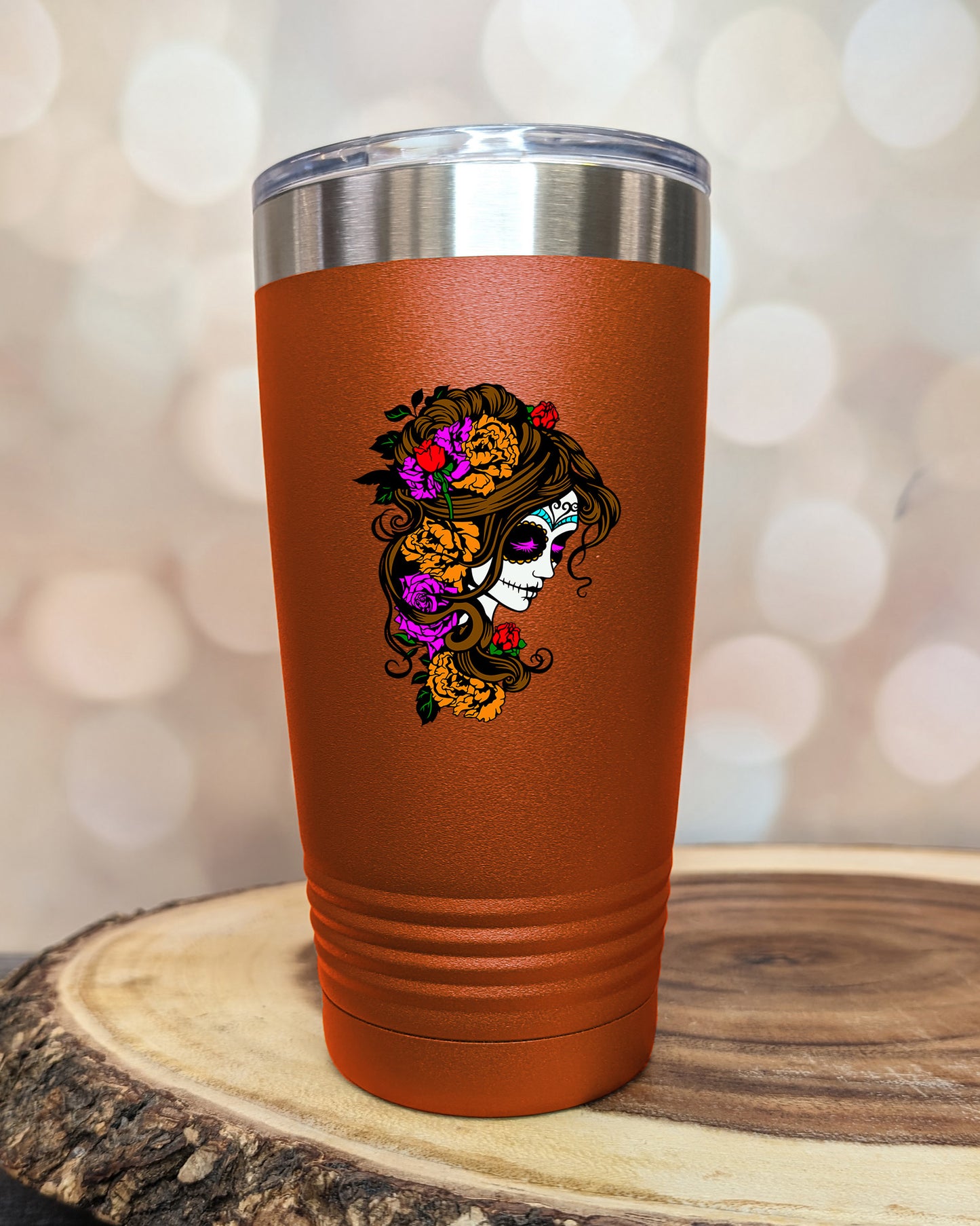 insulated tumbler featuring a colorful sugar skull woman portrait with floral accents and Day of the Dead-inspired artwork.