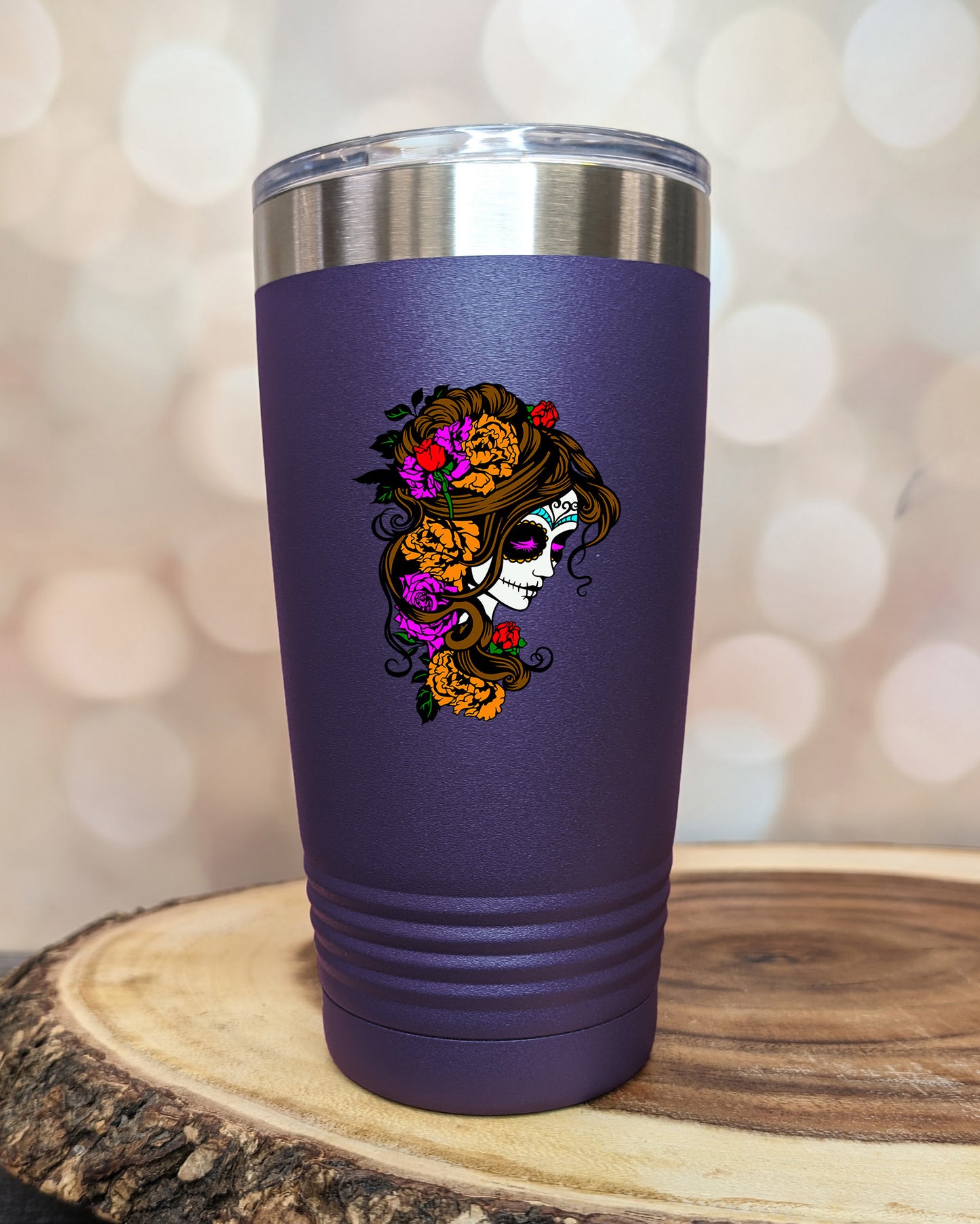 insulated tumbler featuring a colorful sugar skull woman portrait with floral accents and Day of the Dead-inspired artwork.