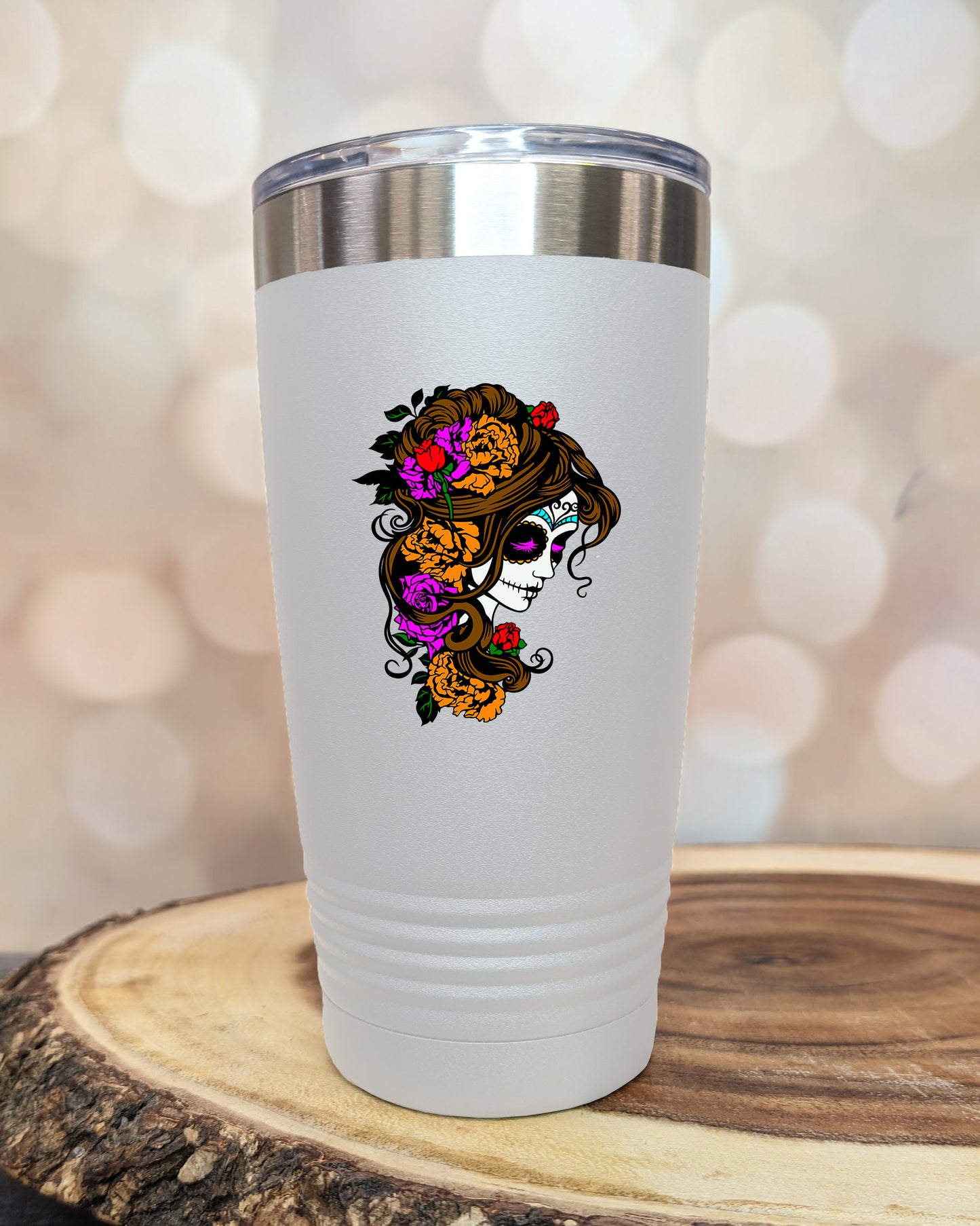 insulated tumbler featuring a colorful sugar skull woman portrait with floral accents and Day of the Dead-inspired artwork.