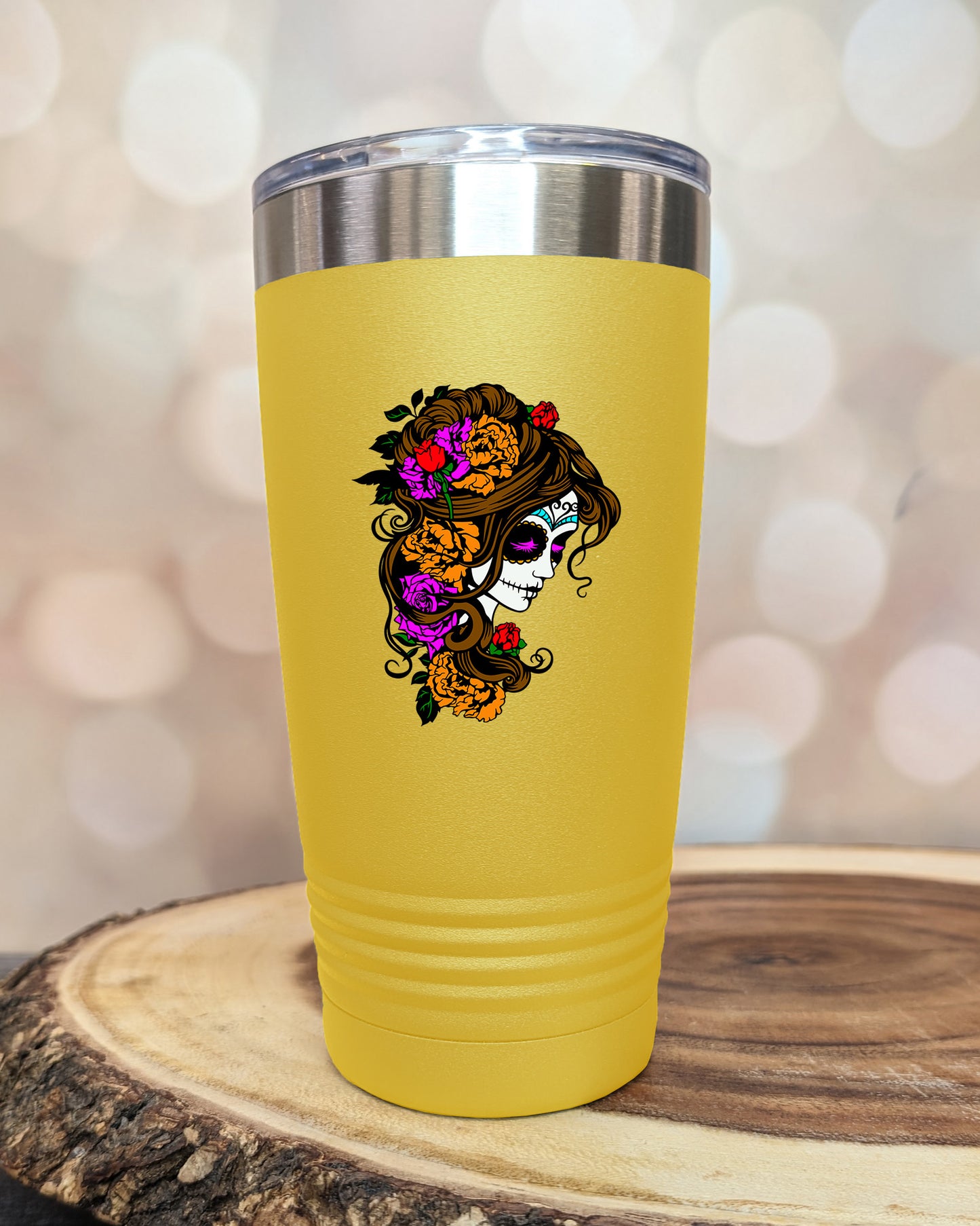 insulated tumbler featuring a colorful sugar skull woman portrait with floral accents and Day of the Dead-inspired artwork.