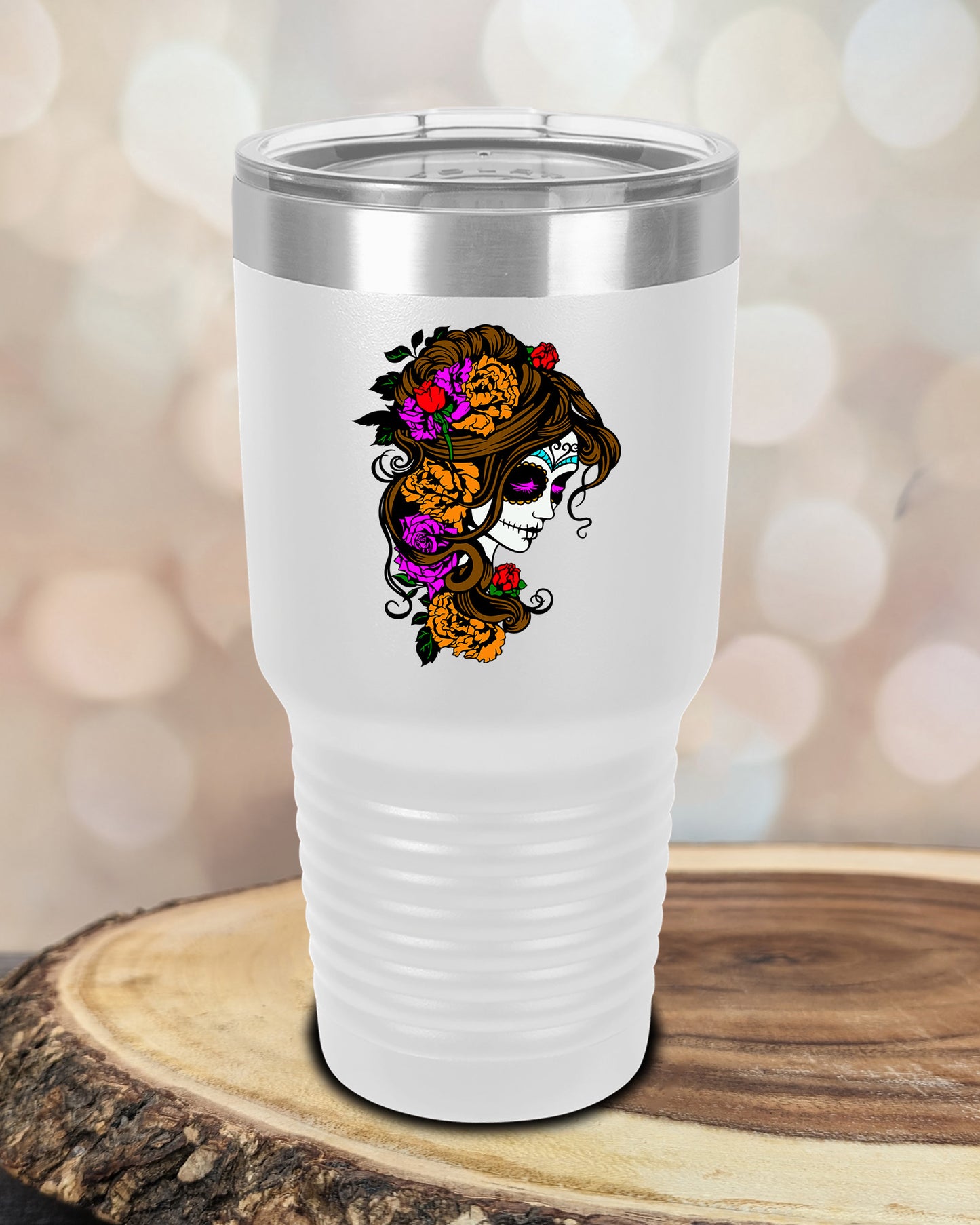 insulated tumbler featuring a colorful sugar skull woman portrait with floral accents and Day of the Dead-inspired artwork.