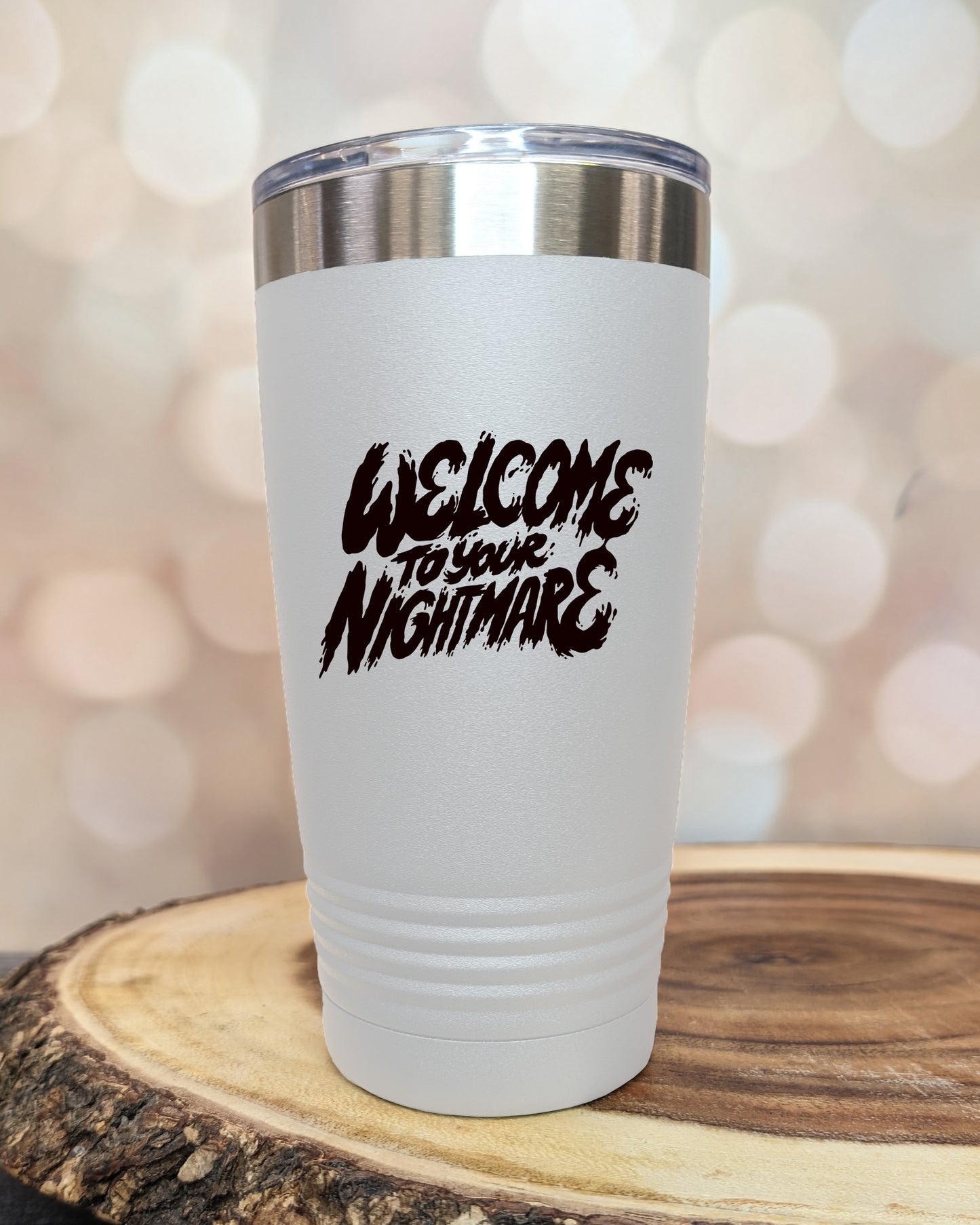 Insulated tumbler featuring Welcome to Your Nightmare horror-themed typography, available in multiple colors and sizes including 20 oz, 30 oz, and 40 oz.