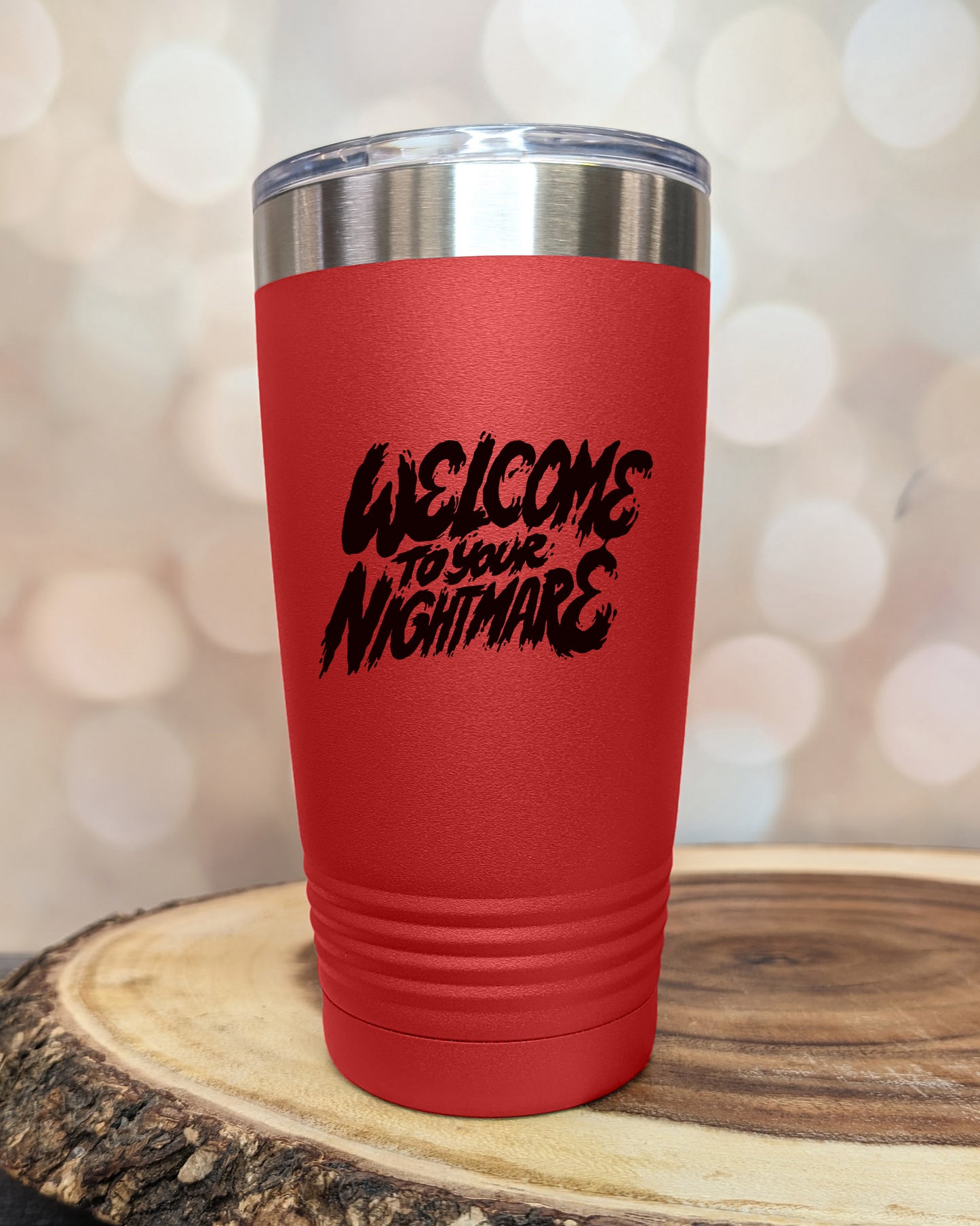 Insulated tumbler featuring Welcome to Your Nightmare horror-themed typography, available in multiple colors and sizes including 20 oz, 30 oz, and 40 oz.