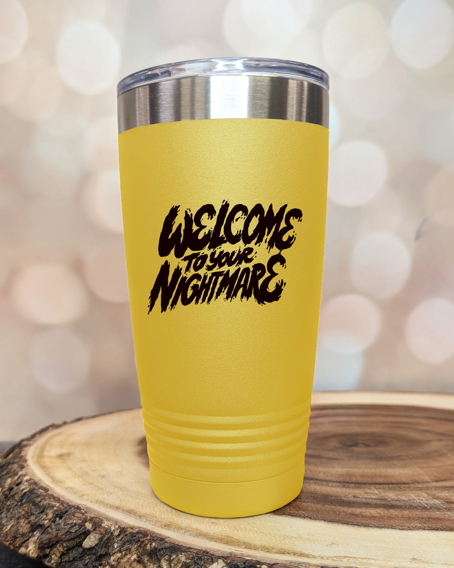 Insulated tumbler featuring Welcome to Your Nightmare horror-themed typography, available in multiple colors and sizes including 20 oz, 30 oz, and 40 oz.