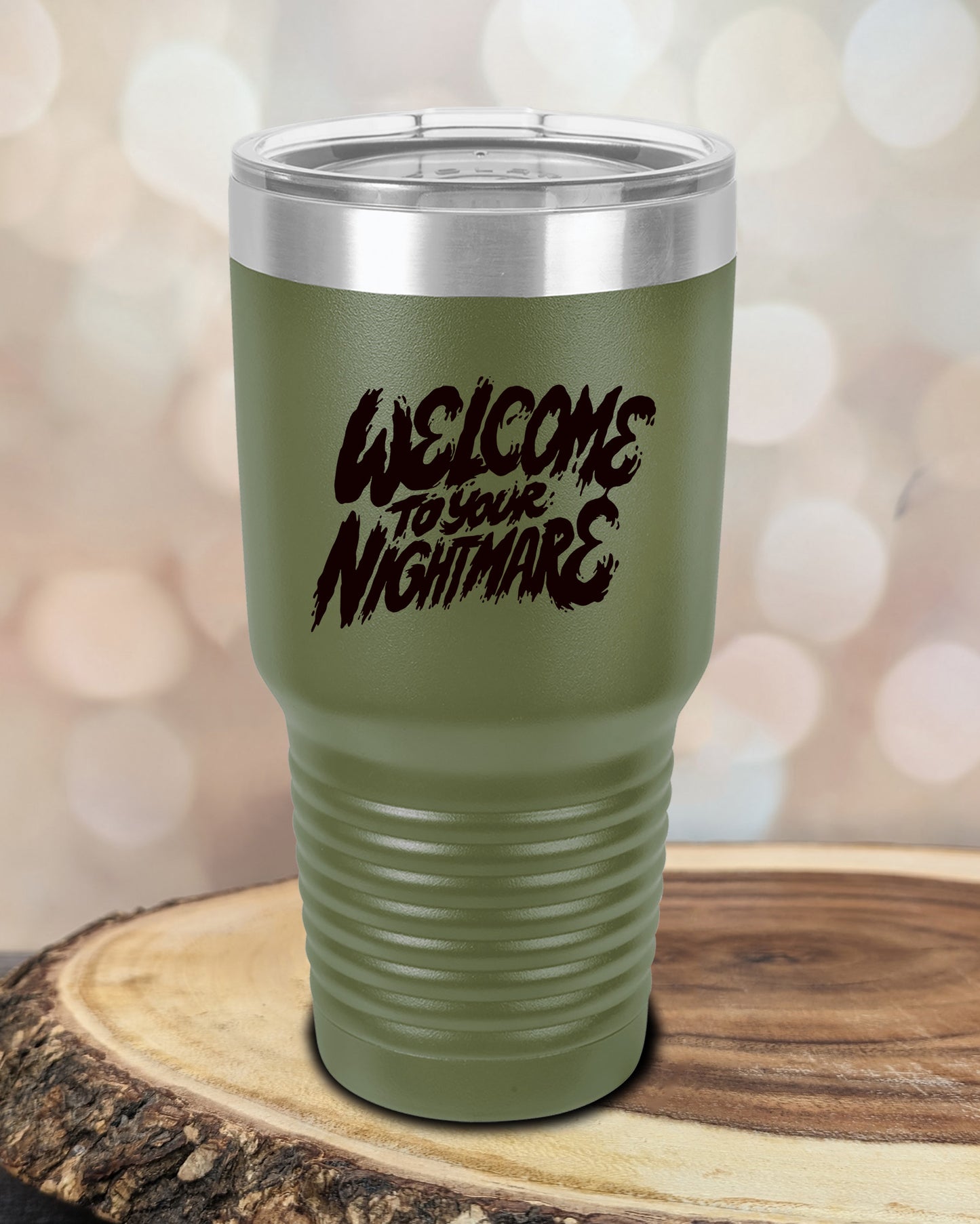 Insulated tumbler featuring Welcome to Your Nightmare horror-themed typography, available in multiple colors and sizes including 20 oz, 30 oz, and 40 oz.