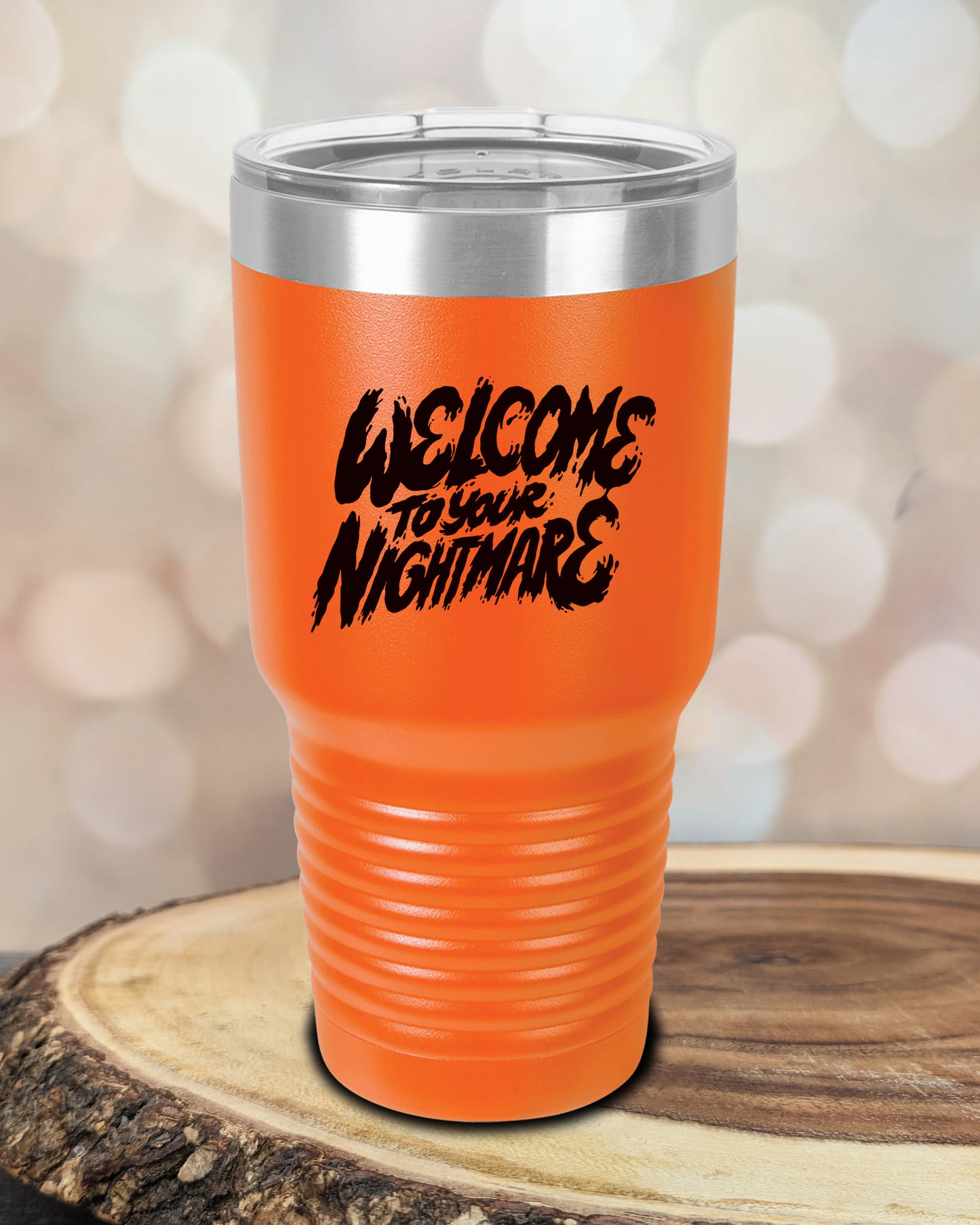 Insulated tumbler featuring Welcome to Your Nightmare horror-themed typography, available in multiple colors and sizes including 20 oz, 30 oz, and 40 oz.