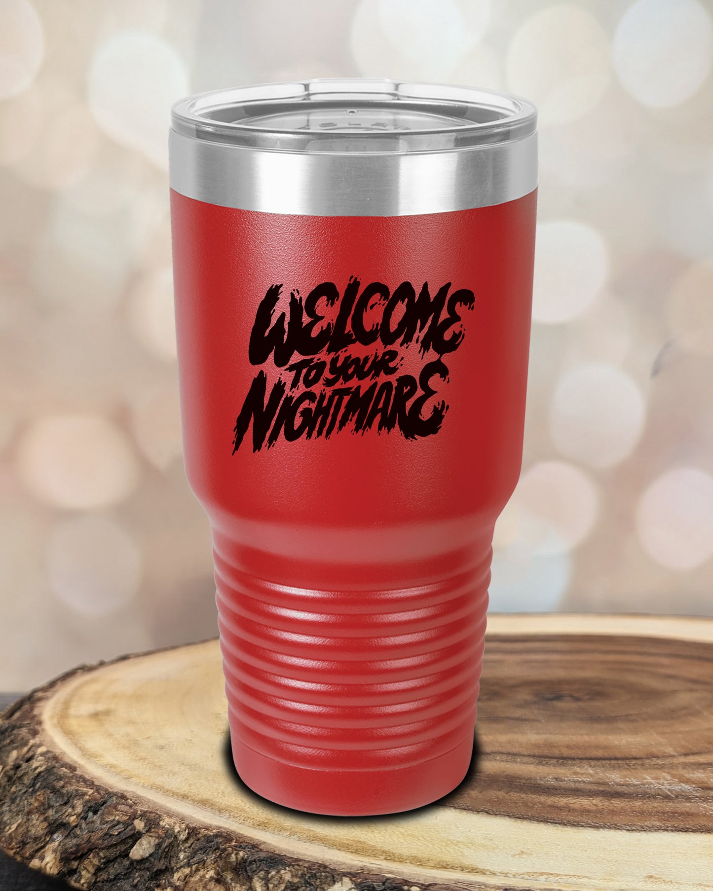 Insulated tumbler featuring Welcome to Your Nightmare horror-themed typography, available in multiple colors and sizes including 20 oz, 30 oz, and 40 oz.