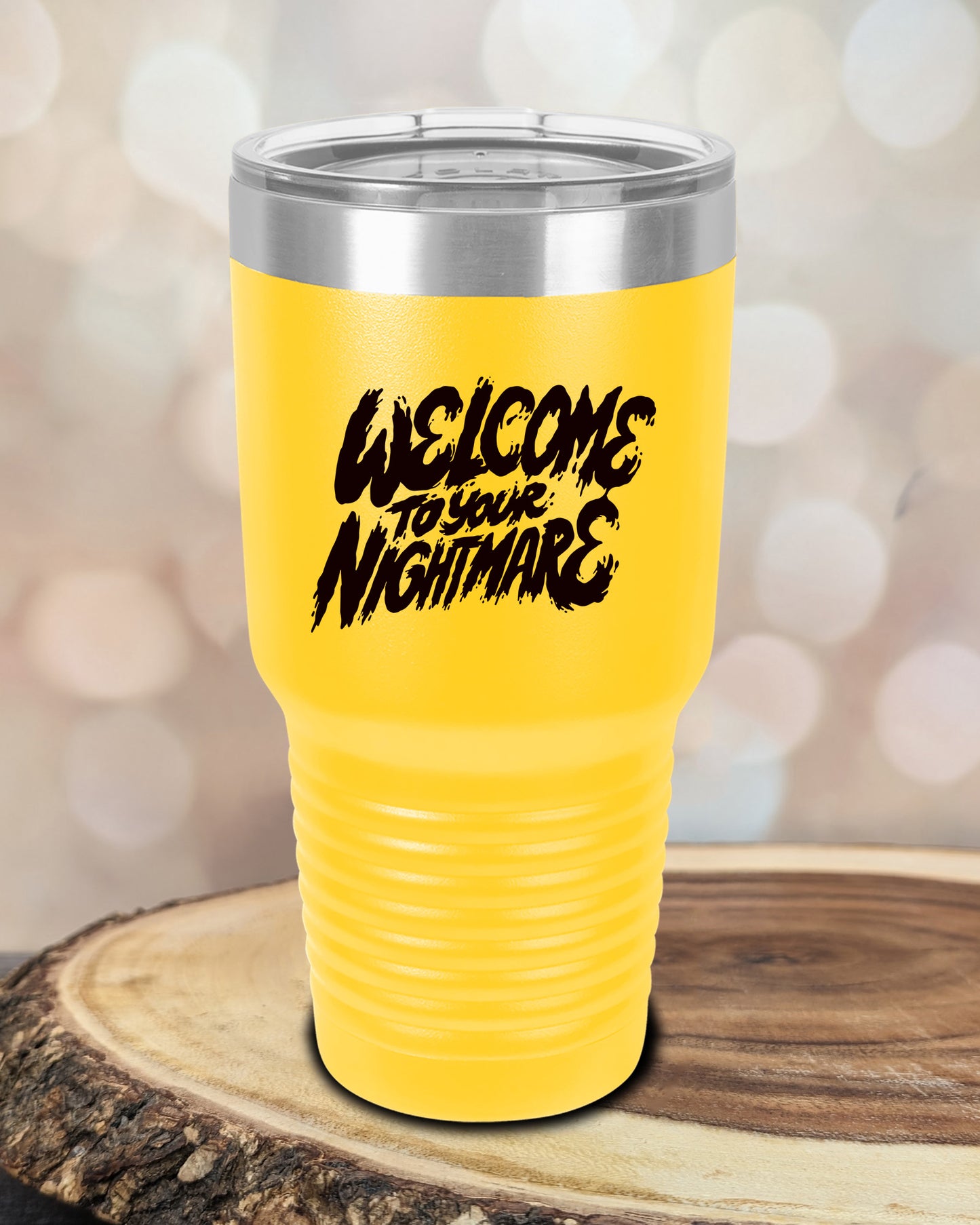 Insulated tumbler featuring Welcome to Your Nightmare horror-themed typography, available in multiple colors and sizes including 20 oz, 30 oz, and 40 oz.