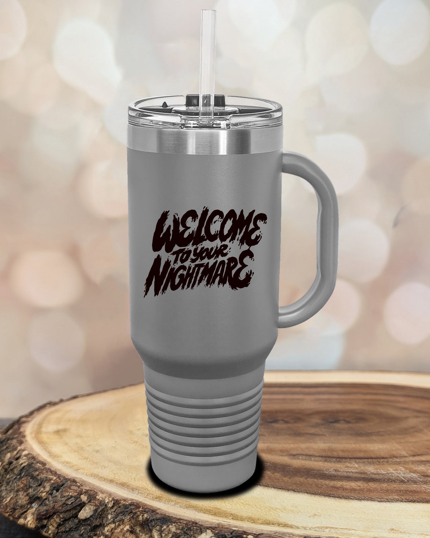 Insulated tumbler featuring Welcome to Your Nightmare horror-themed typography, available in multiple colors and sizes including 20 oz, 30 oz, and 40 oz.