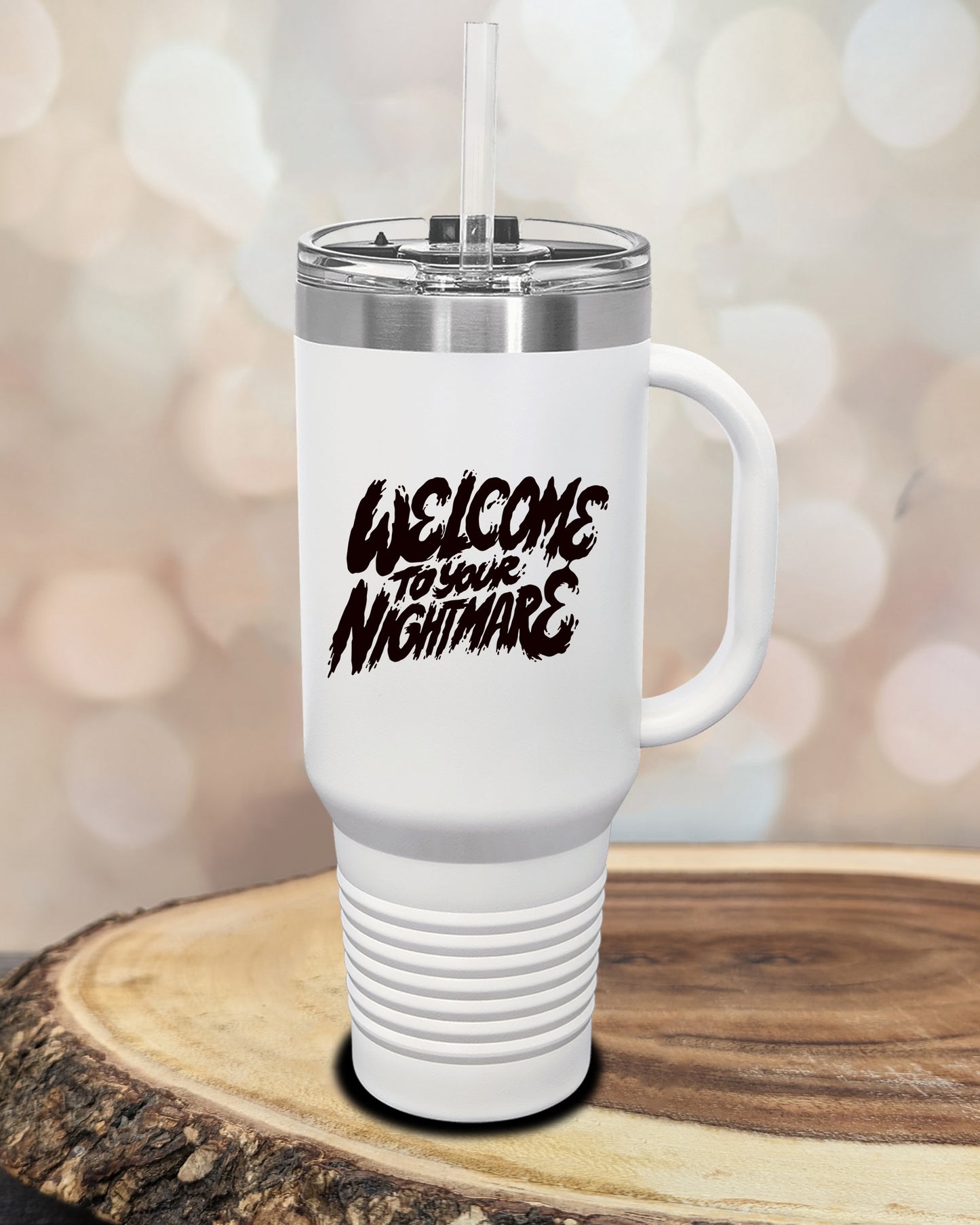 Insulated tumbler featuring Welcome to Your Nightmare horror-themed typography, available in multiple colors and sizes including 20 oz, 30 oz, and 40 oz.